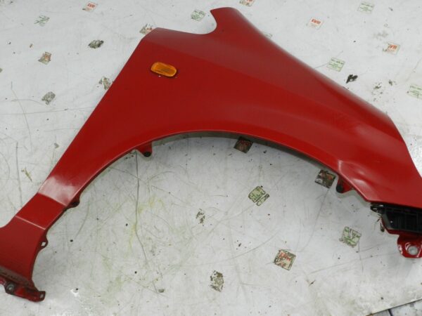 (129) 2005 HONDA JAZZ. DRIVER SIDE WING IN RED DENTED