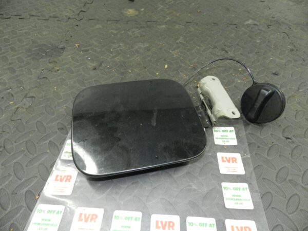 2009 NISSAN QASHQAI J10. FUEL FLAP CAP COVER IN BLACK