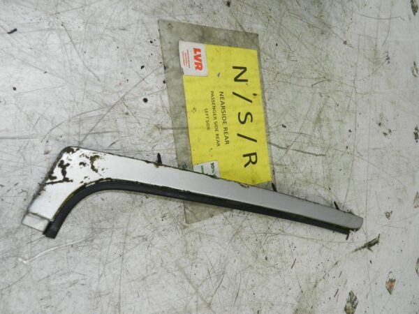 1990 VOLVO 700 740. PASSENGER SIDE REAR WINDOW TRIM SILVER