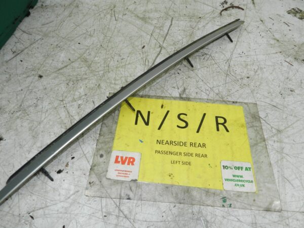 1990 VOLVO 700 740. PASSENGER SIDE REAR WINDOW TRIM SILVER