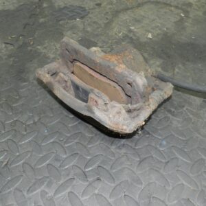 162. 1996 HONDA SMX. PASSENGER SIDE FRONT BRAKE CALIPER + CARRIER