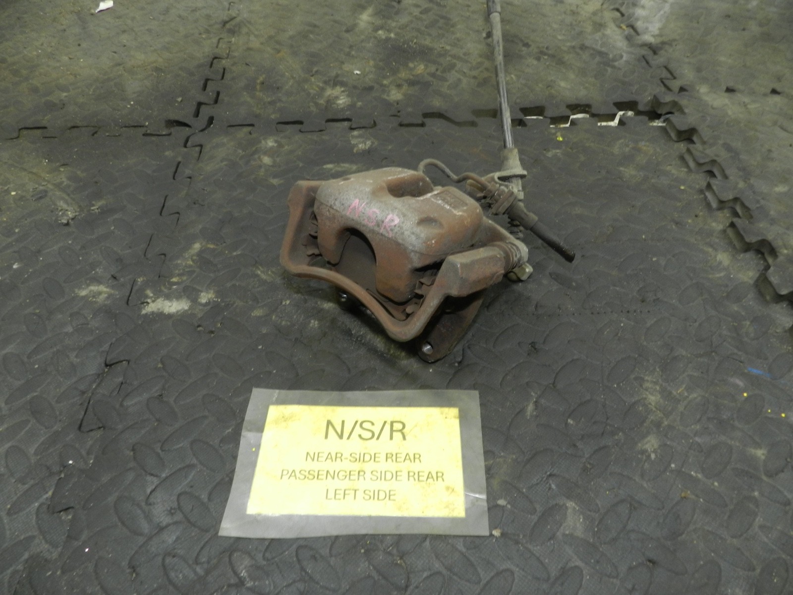 179. 2006 VOLKSWAGEN TOURAN. PASSENGER SIDE REAR BRAKE CALIPER + CARRIER